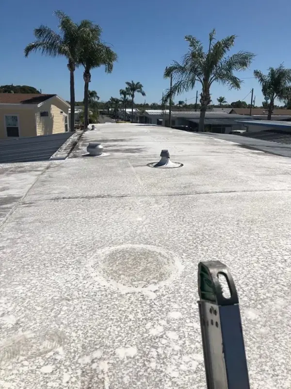 Chalky mobile home flat roof before painting