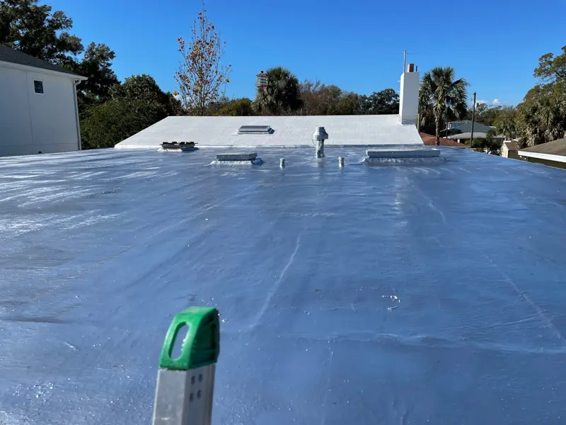 Flat roof after painting with a bright silver reflective finish on a Sarasota home