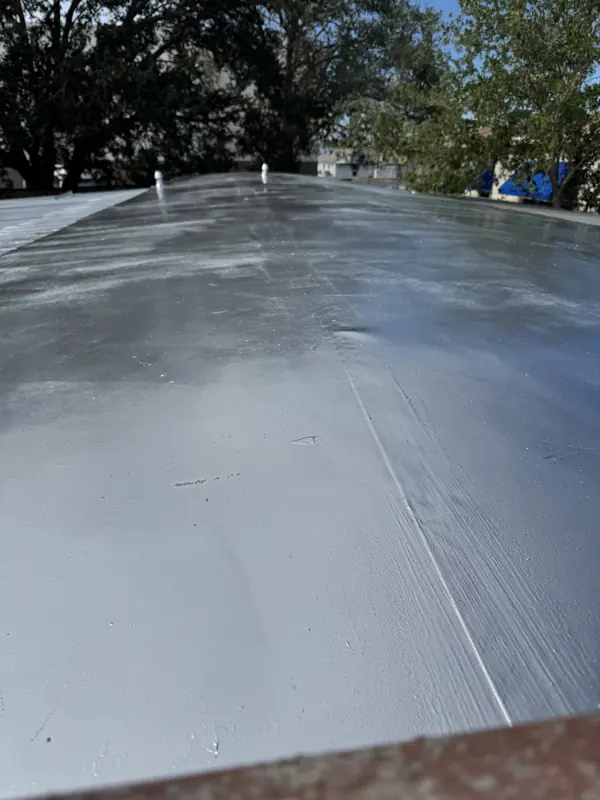 Close-up of a silver topcoat on a flat roof