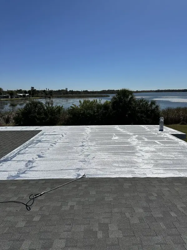 Flat roof with new white finish on a lakefront Sarasota home