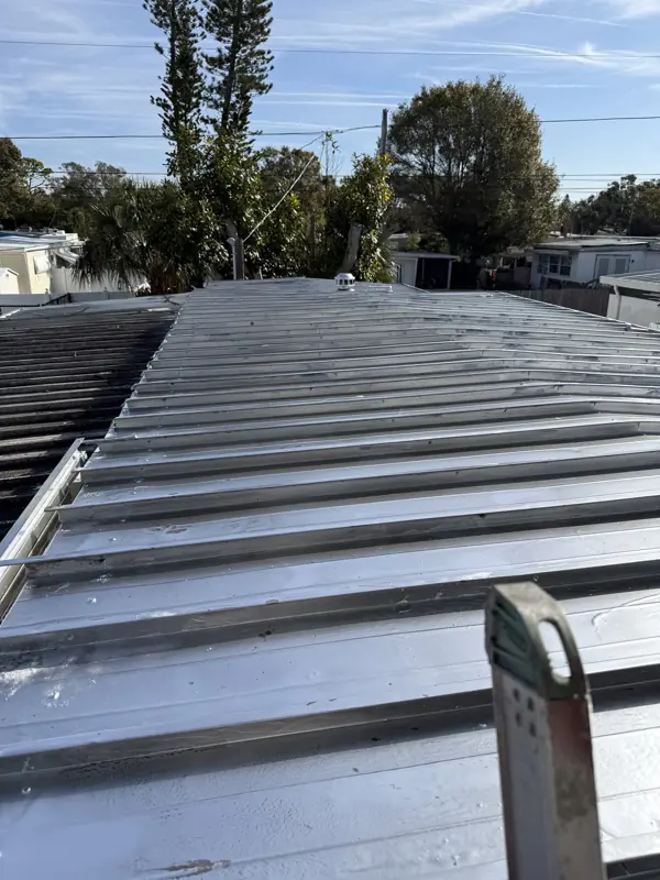 Mobile home metal roof after painting in a Florida community