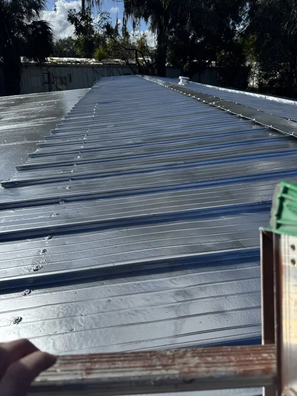 Mobile home metal roof after painting silver