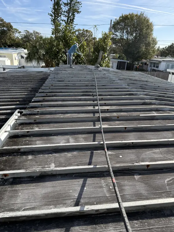 Mobile home metal roof before painting in a Florida community