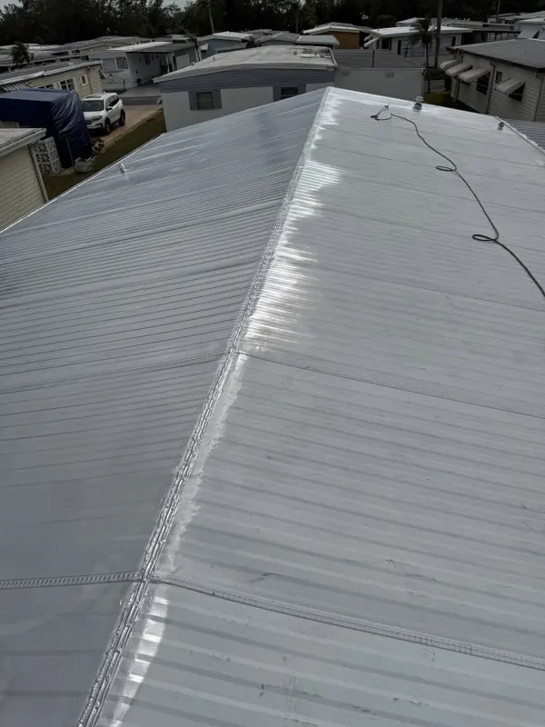 Mobile home metal roof painted white, ridge view