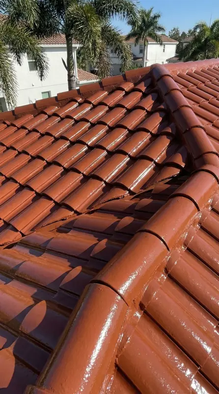 Orange barrel tile roof after painting with a glossy finish