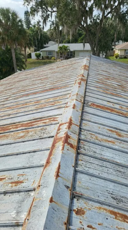 Rusty mobile home metal roof before painting