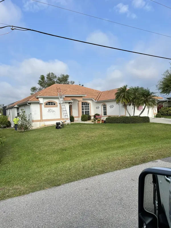 Ranch home with terracotta tile roof after painting