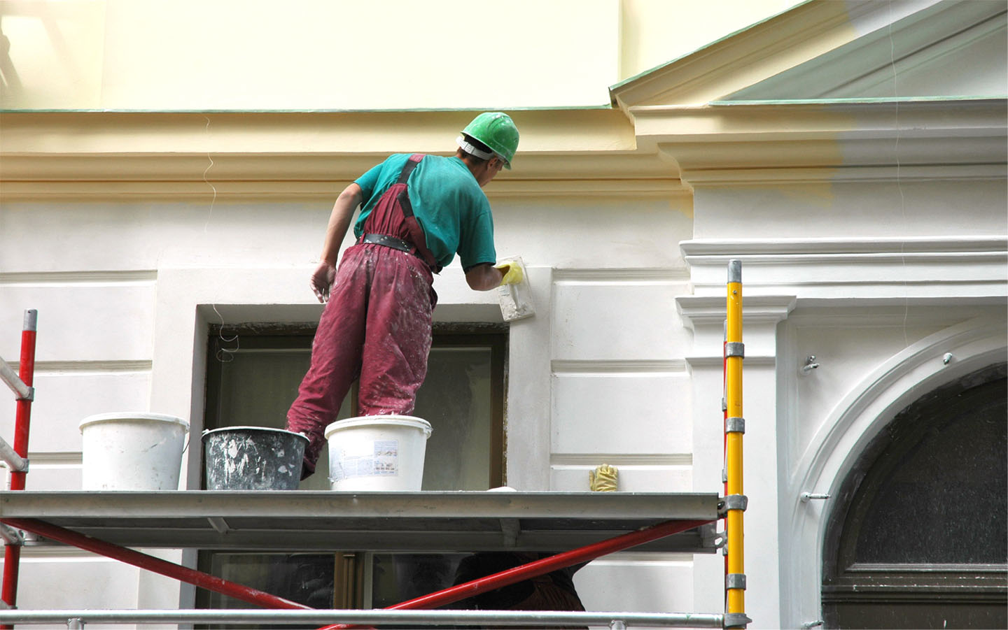 Painter on scaffolding