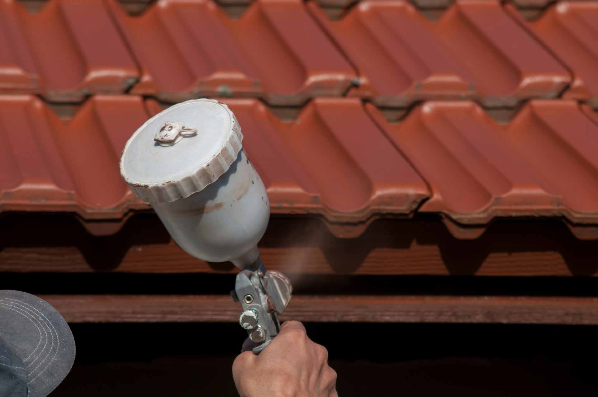 Close-up on airbrush used for painting clay tile roof